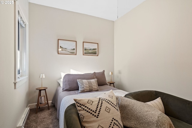 carpeted bedroom with a baseboard radiator