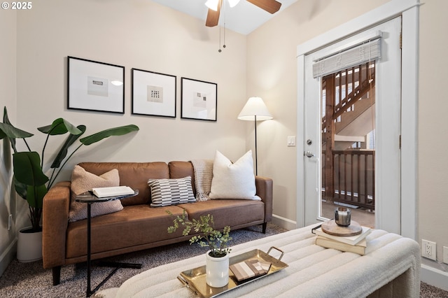 living room featuring ceiling fan and carpet