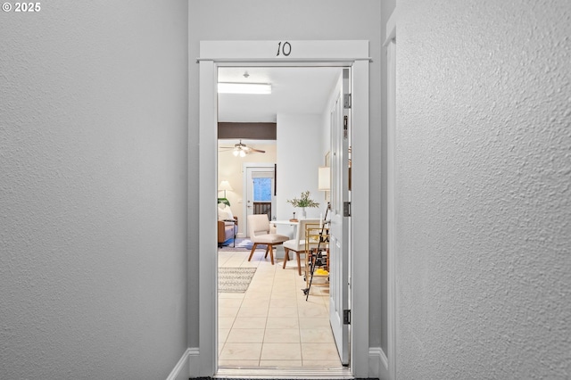 corridor with light tile patterned floors