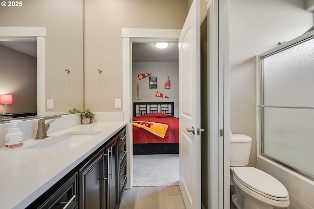 full bathroom with vanity, combined bath / shower with glass door, and toilet