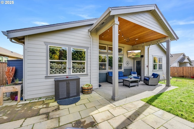 back of house featuring an outdoor hangout area, a patio, and a yard