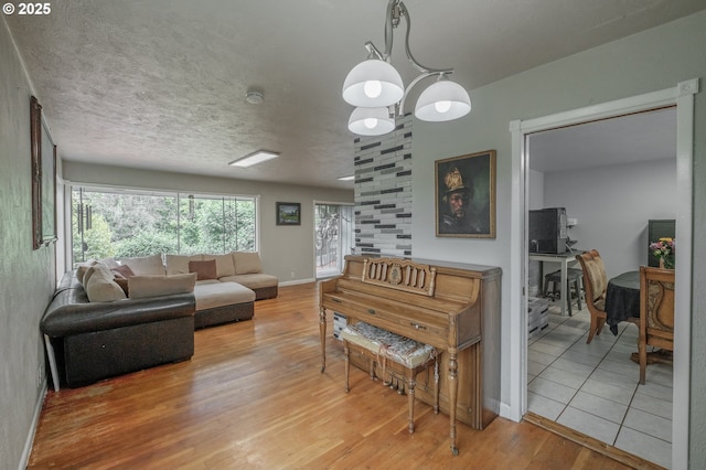 living room with light wood-type flooring and baseboards