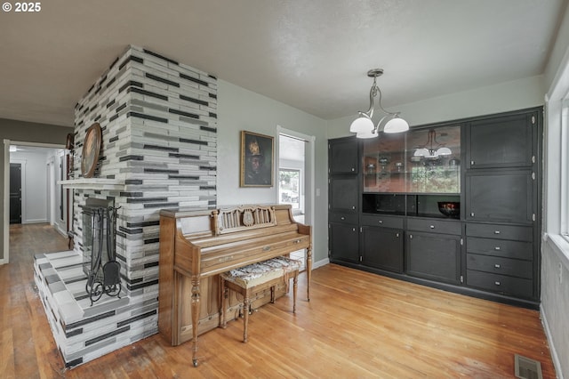 dining area featuring light wood finished floors and baseboards