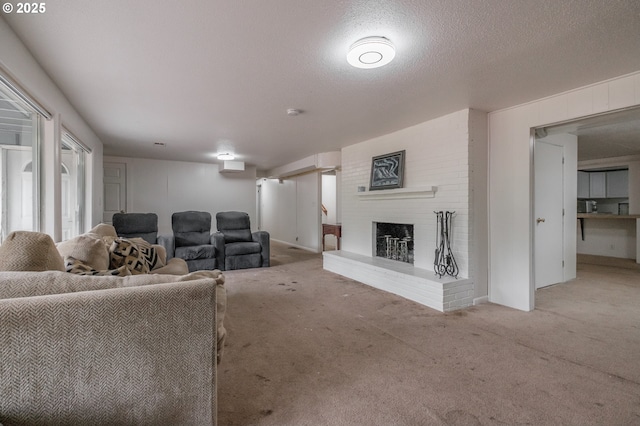 living area with carpet floors, a brick fireplace, and a textured ceiling