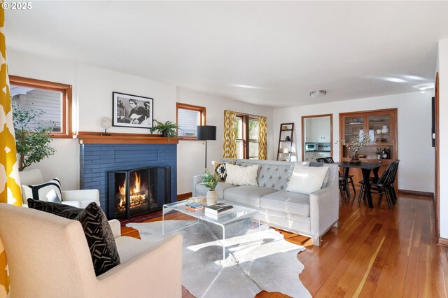 living room featuring a fireplace and wood-type flooring