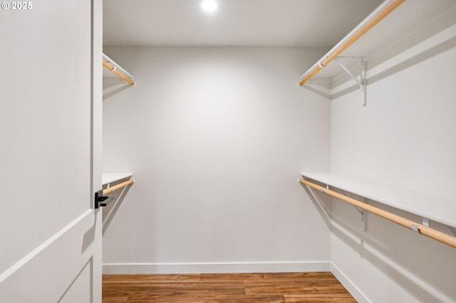 spacious closet with wood finished floors