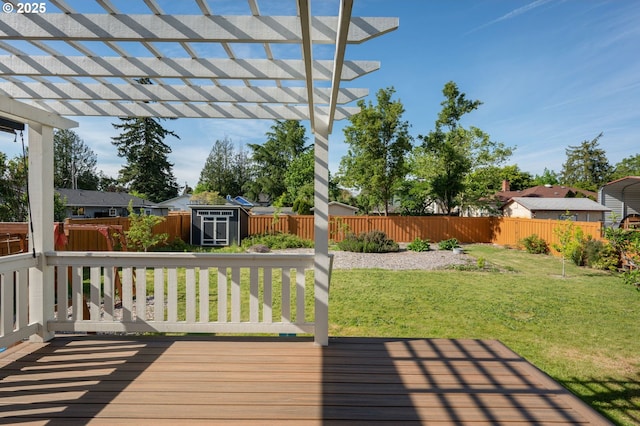 deck with a pergola, a yard, and a fenced backyard