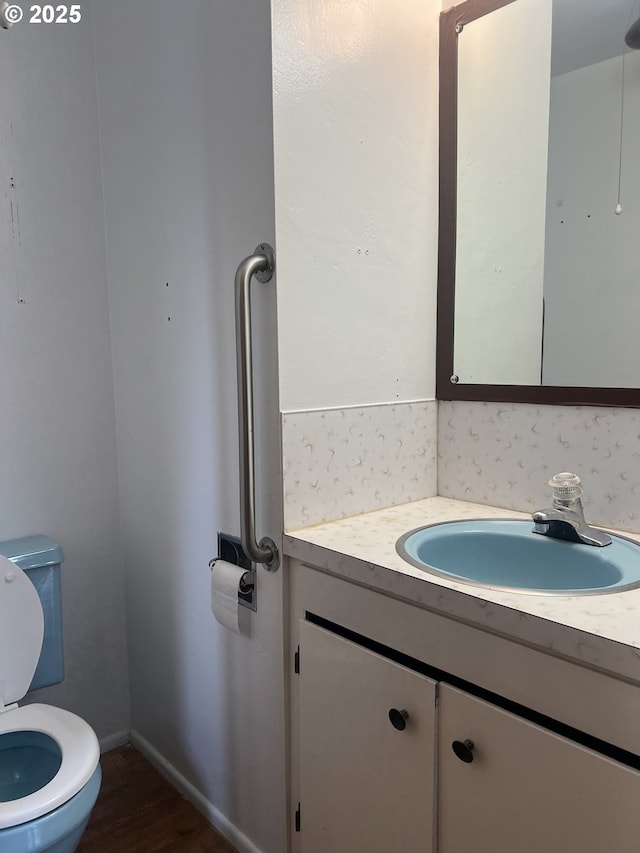 2711 Bowman Rd, Reedsport, OR 97467 - bathroom with vanity and wood finished floors