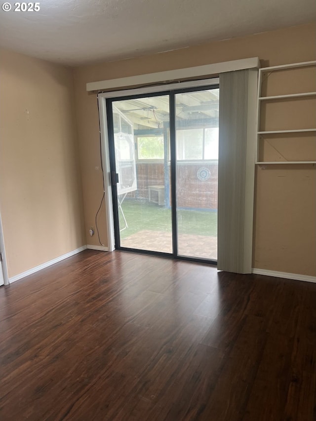 2711 Bowman Rd, Reedsport, OR 97467 - unfurnished room with dark wood-type flooring and baseboards