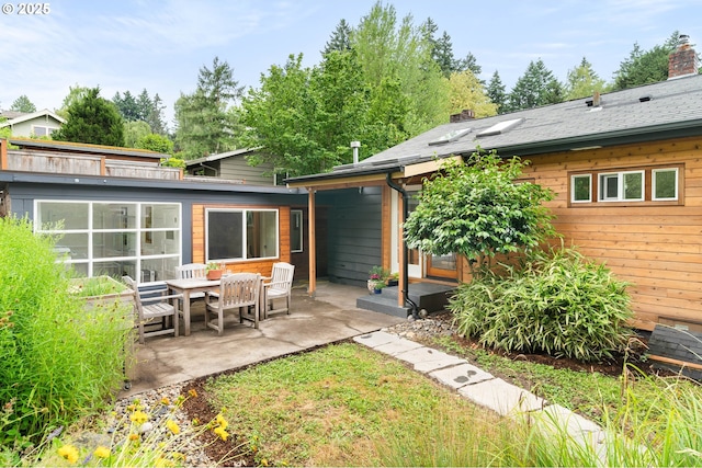 8160 SW 41st Ave, Portland, OR 97219 - back of house featuring a patio and a chimney