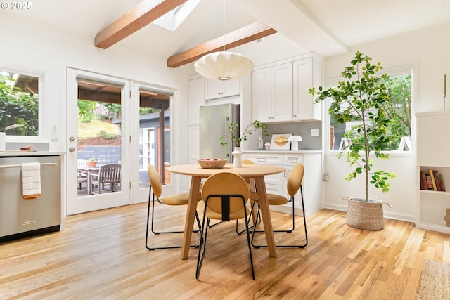 8160 SW 41st Ave, Portland, OR 97219 - dining room featuring beamed ceiling, light wood-type flooring, and a skylight