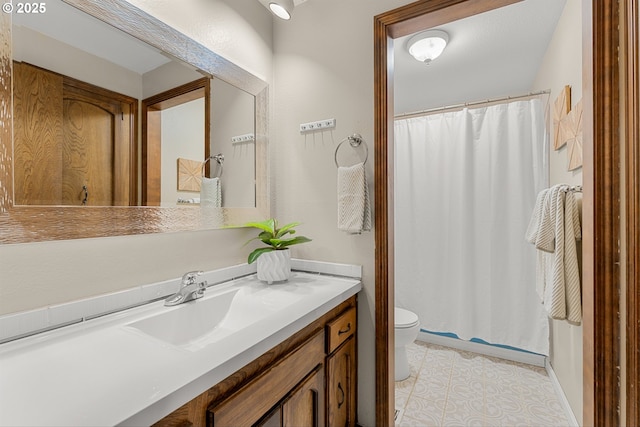 15648 NE Rose Pkwy, Portland, OR 97230 - bathroom featuring toilet, vanity, a shower with shower curtain, and tile patterned flooring