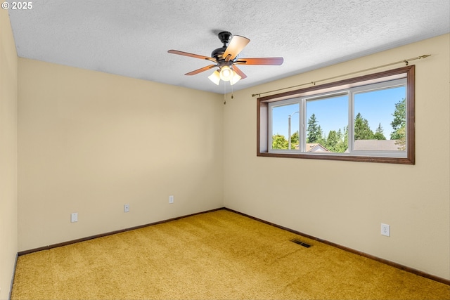 15648 NE Rose Pkwy, Portland, OR 97230 - unfurnished room featuring light carpet, baseboards, ceiling fan, and a textured ceiling