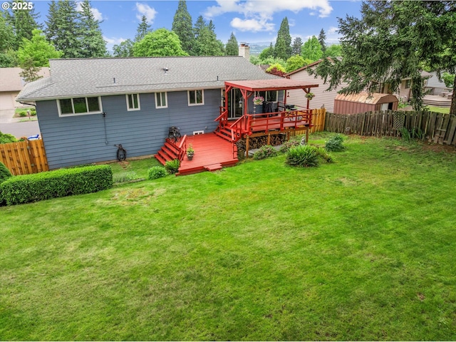 15648 NE Rose Pkwy, Portland, OR 97230 - back of property featuring a deck, a fenced backyard, a chimney, and a shingled roof