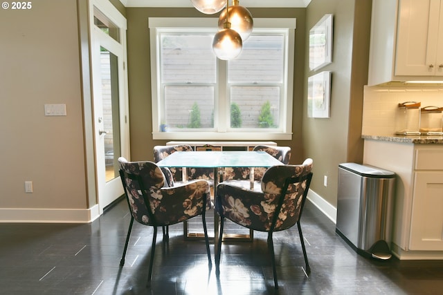 3225 SE Lincoln St, Portland, OR 97214 - dining space featuring baseboards and dark wood-style flooring