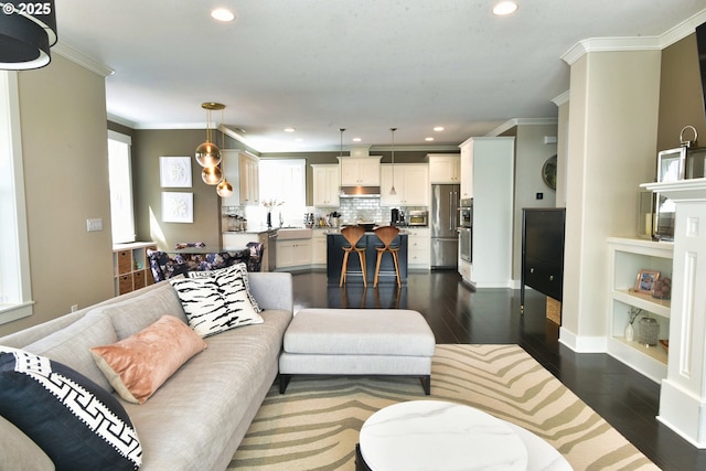 3225 SE Lincoln St, Portland, OR 97214 - living area featuring crown molding, dark wood-style flooring, recessed lighting, and baseboards