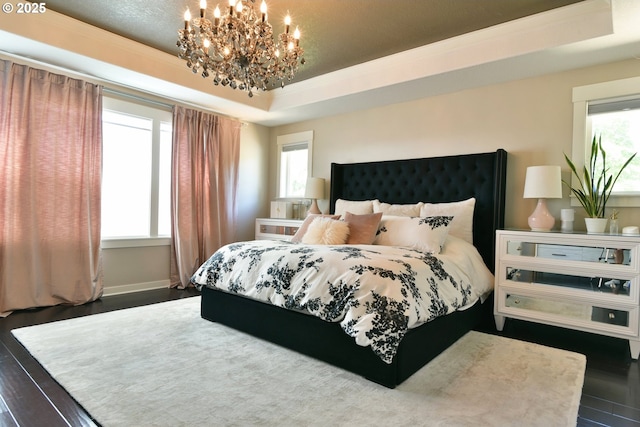 3225 SE Lincoln St, Portland, OR 97214 - bedroom with a chandelier, a tray ceiling, multiple windows, and wood finished floors