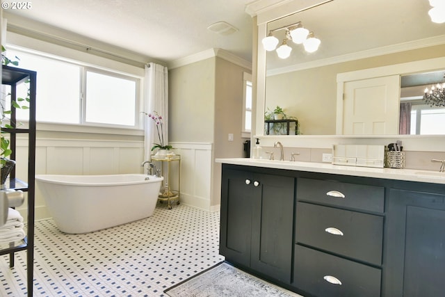 3225 SE Lincoln St, Portland, OR 97214 - full bathroom with double vanity, a wainscoted wall, a freestanding tub, crown molding, and a decorative wall