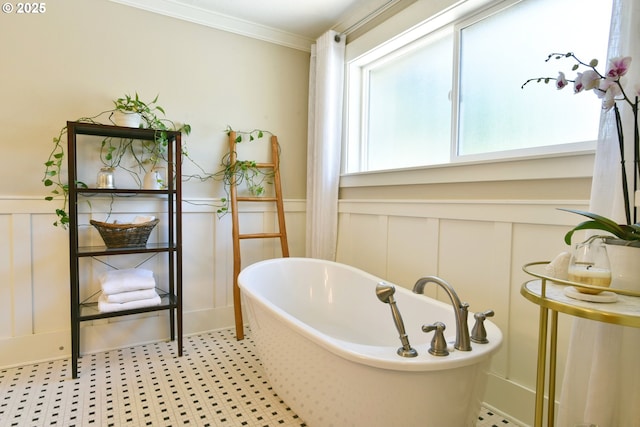 3225 SE Lincoln St, Portland, OR 97214 - bathroom featuring a decorative wall, a soaking tub, ornamental molding, and wainscoting