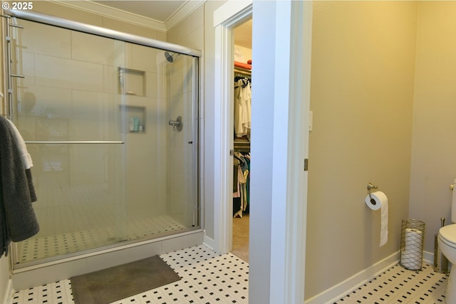 3225 SE Lincoln St, Portland, OR 97214 - full bath with a stall shower, toilet, a walk in closet, crown molding, and tile patterned floors