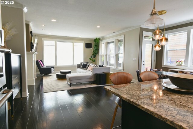 3225 SE Lincoln St, Portland, OR 97214 - living area featuring crown molding, dark wood-style flooring, baseboards, and recessed lighting