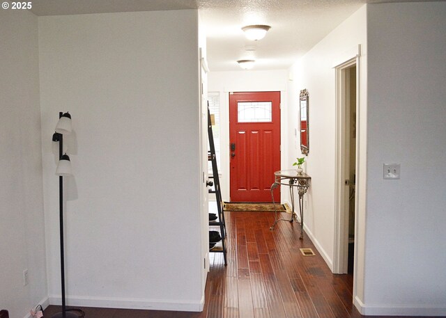 bedroom featuring light carpet and a textured ceiling