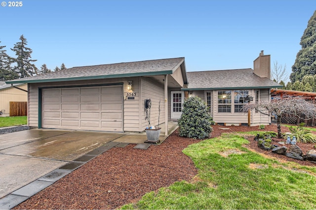 ranch-style house with concrete driveway, roof with shingles, a chimney, and an attached garage