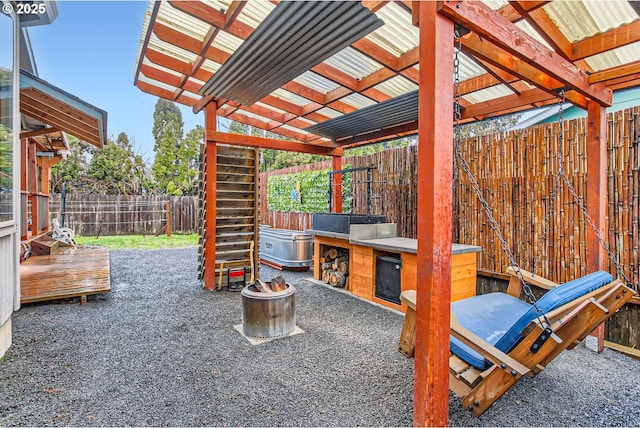 view of patio / terrace with a fenced backyard and outdoor dry bar