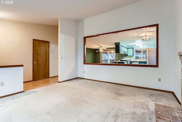 empty room with carpet floors and baseboards