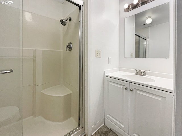 full bathroom featuring vanity and a shower stall