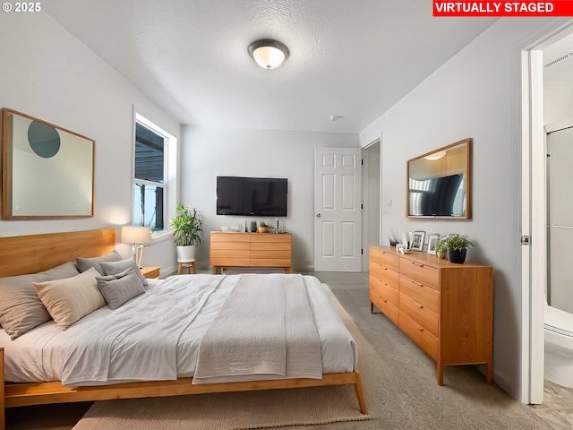 bedroom with light colored carpet