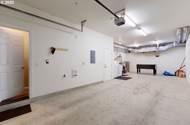 garage with a garage door opener and electric panel