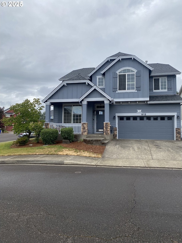 812 N 27th Ave, Cornelius, OR 97113 - craftsman house with stone siding, board and batten siding, a garage, driveway, and a shingled roof