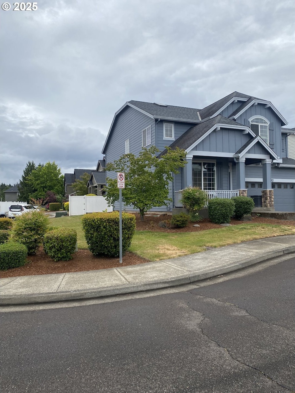 812 N 27th Ave, Cornelius, OR 97113 - view of front of house featuring board and batten siding, covered porch, and a shingled roof