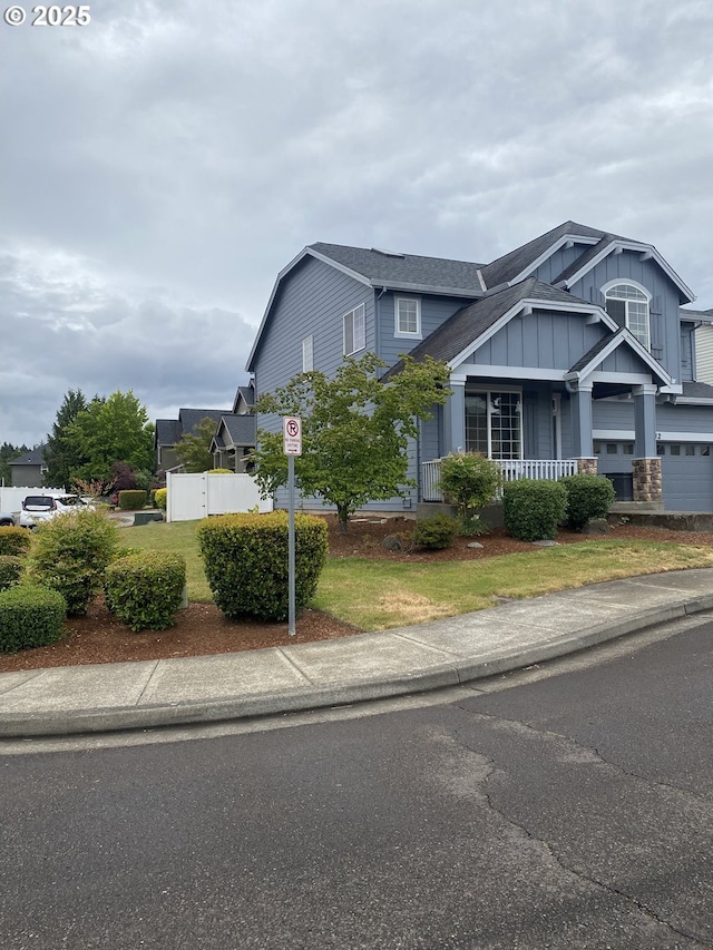 812 N 27th Ave, Cornelius, OR 97113 - view of front of house featuring board and batten siding, covered porch, and a shingled roof