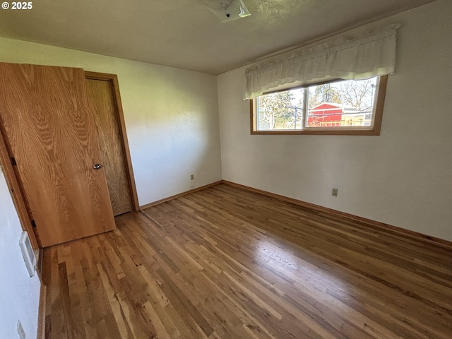 11623 Broadacres Rd NE, Hubbard, OR 97032 - unfurnished bedroom featuring baseboards, wood finished floors, and a closet