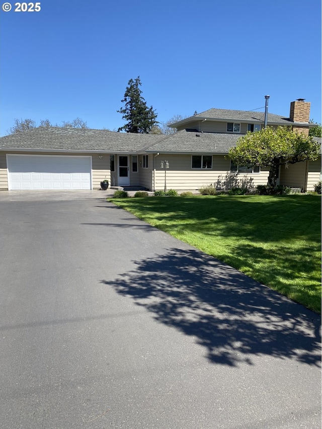 11623 Broadacres Rd NE, Hubbard, OR 97032 - single story home with a chimney, an attached garage, driveway, and a front yard