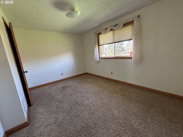 11623 Broadacres Rd NE, Hubbard, OR 97032 - carpeted empty room featuring baseboards and a textured ceiling