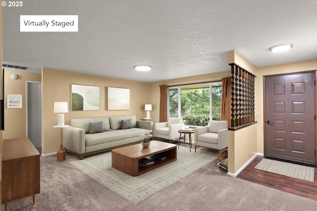 carpeted living room with a textured ceiling