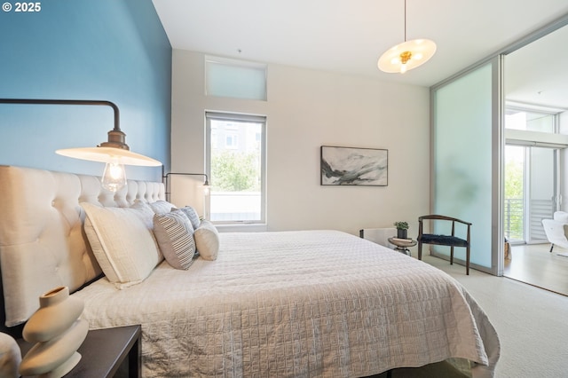 1455 N Killingsworth St Unit 201, Portland, OR 97217 - carpeted bedroom featuring multiple windows