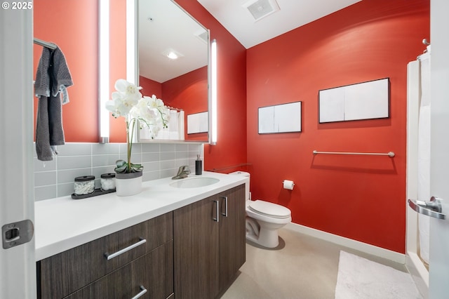 1455 N Killingsworth St Unit 201, Portland, OR 97217 - bathroom with backsplash, vanity, toilet, and a shower with shower curtain