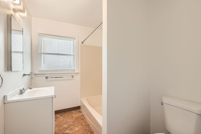 full bath featuring toilet, tub / shower combination, vanity, baseboards, and tile patterned floors