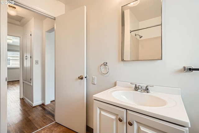 full bathroom with vanity and wood finished floors