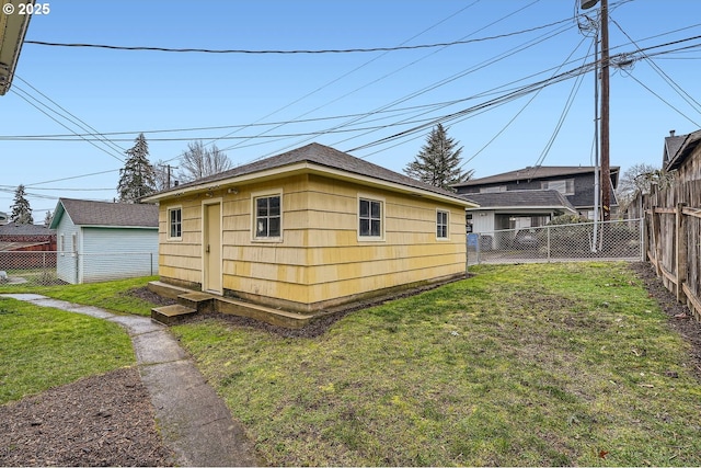 view of outbuilding with an outbuilding, a fenced backyard, and entry steps