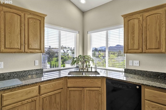 1922 Kapela Ct, Sutherlin, OR 97479 - kitchen featuring black dishwasher, a sink, healthy amount of natural light, dark stone counters, and a textured wall