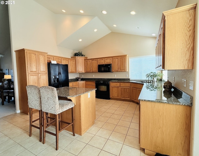 1922 Kapela Ct, Sutherlin, OR 97479 - kitchen featuring black appliances, a breakfast bar area, light tile patterned flooring, high vaulted ceiling, and a center island