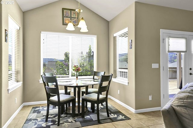 1922 Kapela Ct, Sutherlin, OR 97479 - dining space with a chandelier, light tile patterned floors, vaulted ceiling, and baseboards