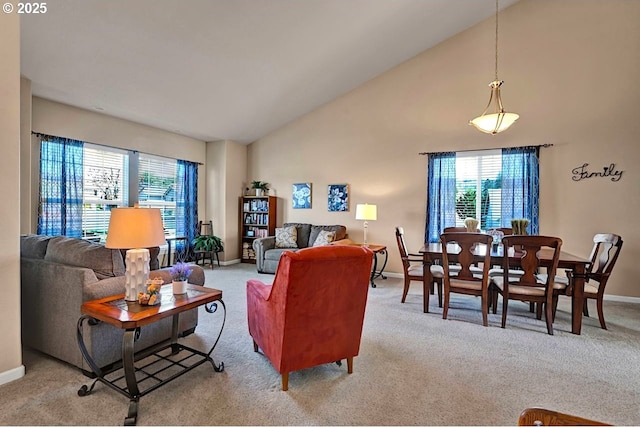 1922 Kapela Ct, Sutherlin, OR 97479 - living room with light colored carpet, baseboards, and high vaulted ceiling