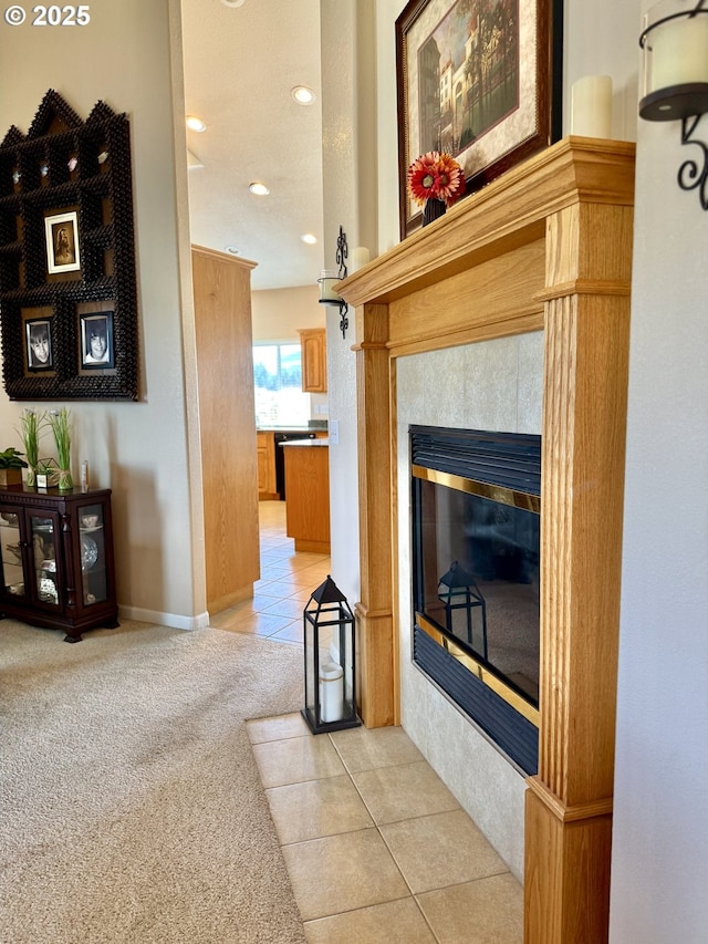 1922 Kapela Ct, Sutherlin, OR 97479 - living area featuring light tile patterned flooring, recessed lighting, light carpet, and a tile fireplace