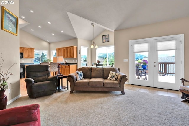 1922 Kapela Ct, Sutherlin, OR 97479 - living room featuring plenty of natural light, light colored carpet, recessed lighting, french doors, and high vaulted ceiling